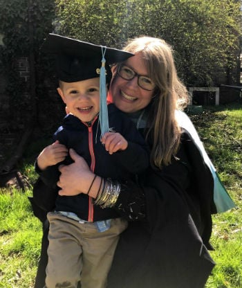 EMU MEd graduate Rebecca Schnakenberg with her son